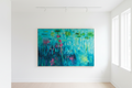 Abstract painting with vibrant colors on a wooden frame