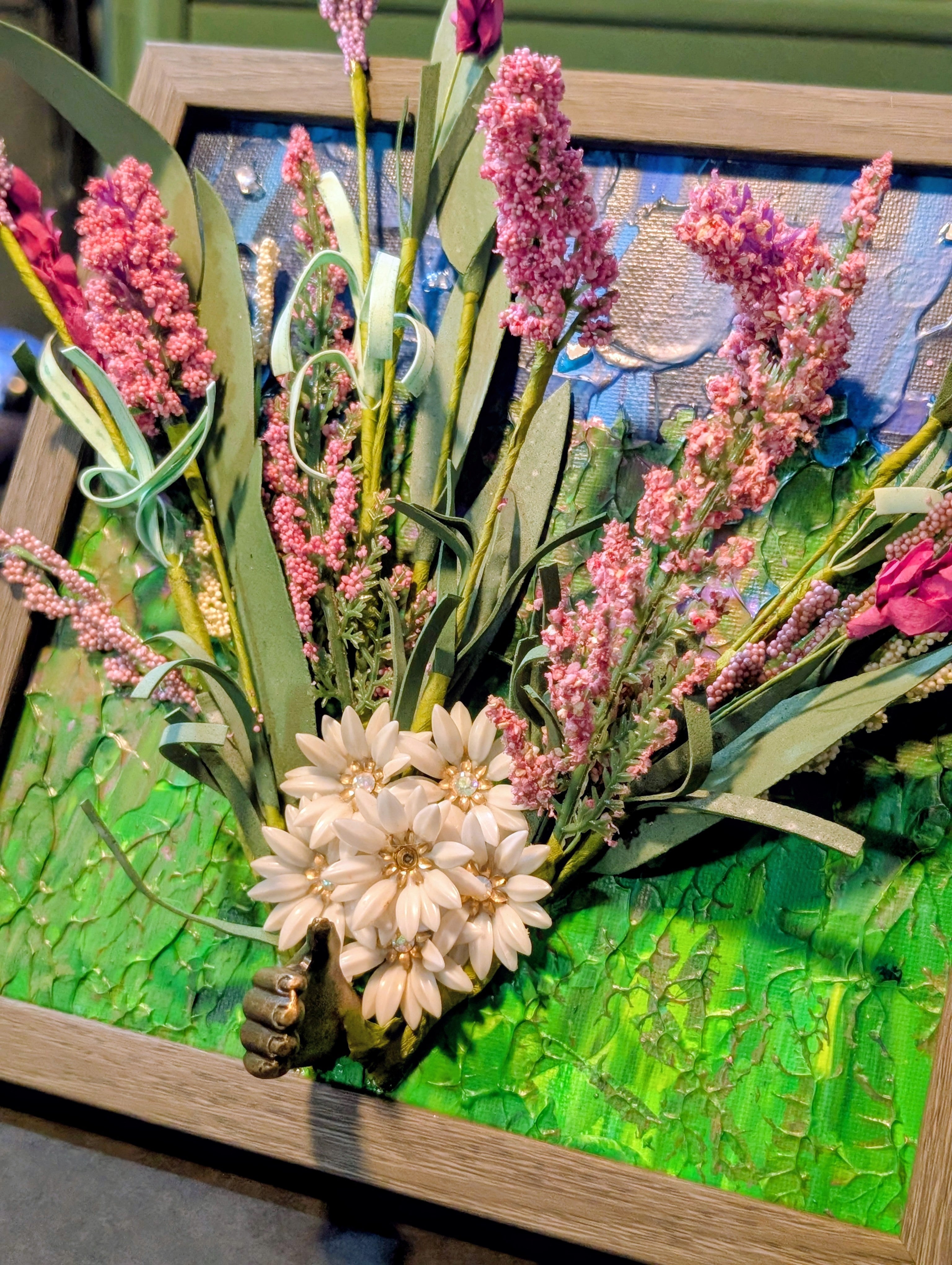 Decorative floral arrangement with pink and white flowers on a textured acrylic painted canvas 